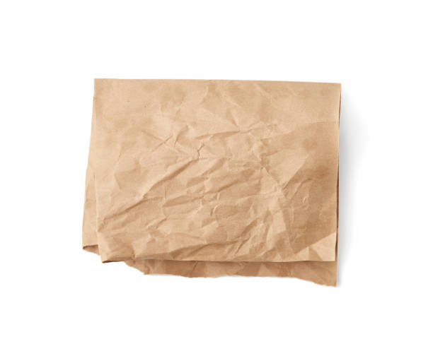 istock folded sheet of brown crumpled paper isolated on white background 1219250850