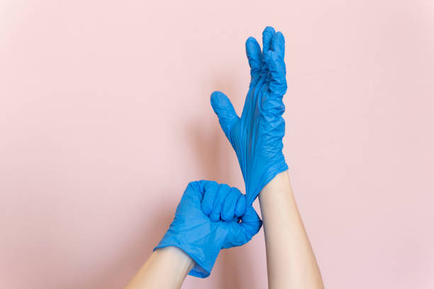 Blue rubber hand gloves stock photo