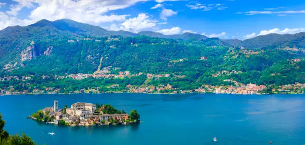 Photo of Beautiful lakes of Italy - lago d'Orta (Orta San Giulio ) and small pictorial island with monastery and village . Piedmont