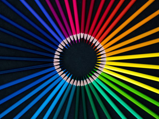 istock Set of colored pencils arranged in a wheel on slate background 1219256093