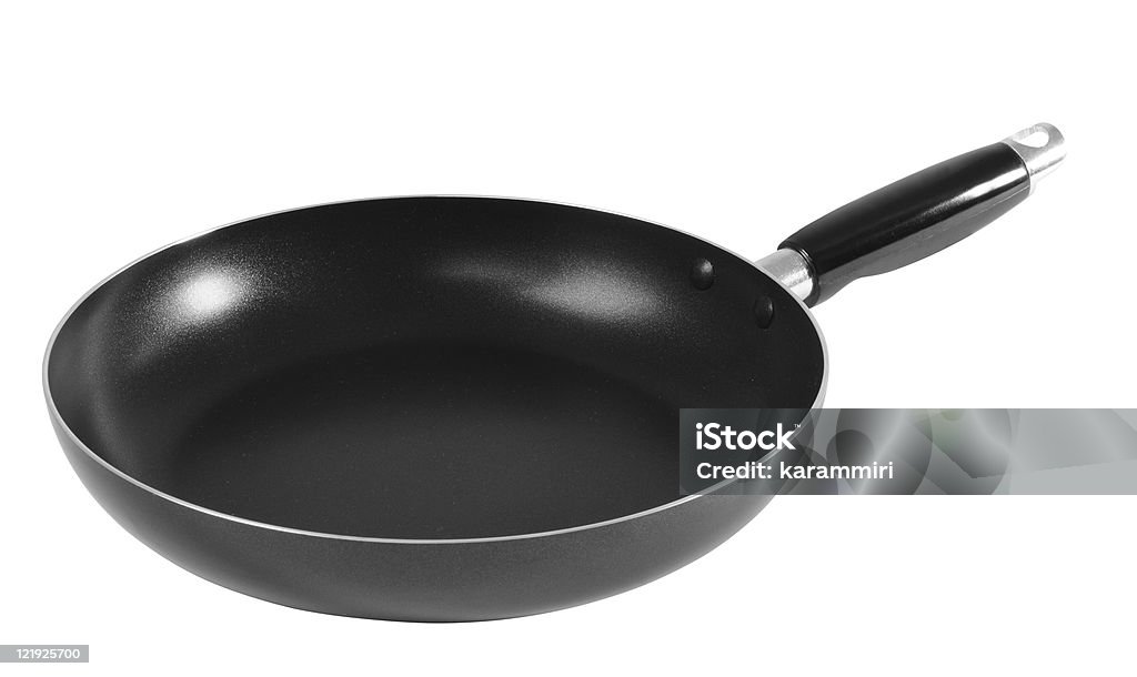 A black skillet on a white background Frying pan over white background. Black Color Stock Photo