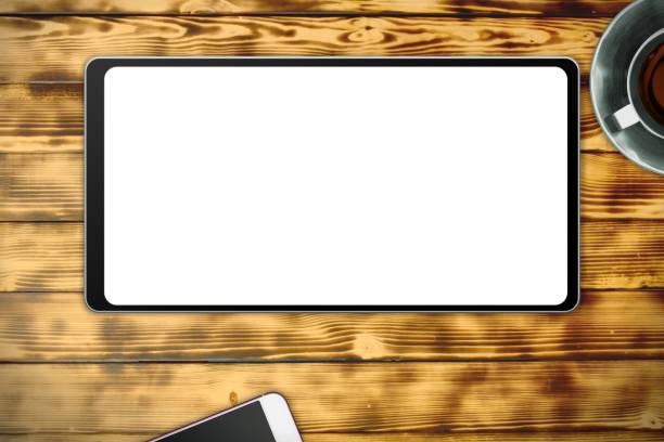 istock modern mockup composed from real photography - tablet with white clear screen on wooden table background 1219257533