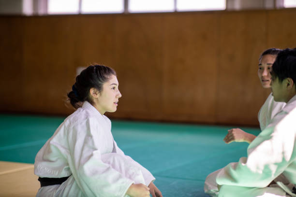 istock Young Judo athletes taking a break in Dojo 1219261202