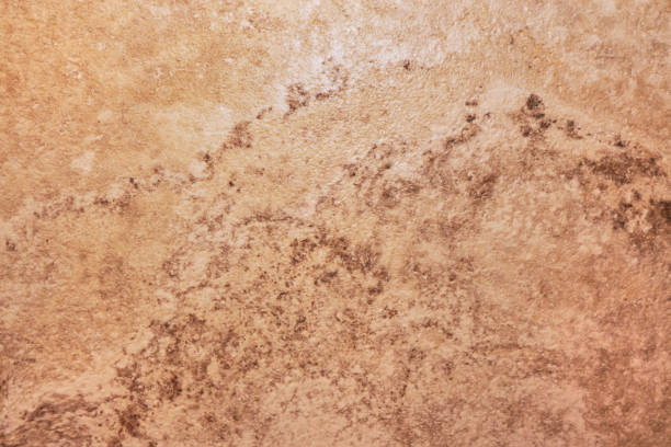 istock Wall texture with cracks and scratches that can be used as background. Background image of the stone surface. Background. An old and worn wall. It can be used for interior-exterior home decoration and ceramic tile surface 1219262144