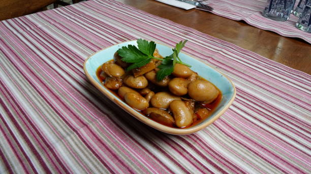 istock Kidney bean & bean grain appetizer in appetizer plate on striped tablecloth and parsley on it 1219264695