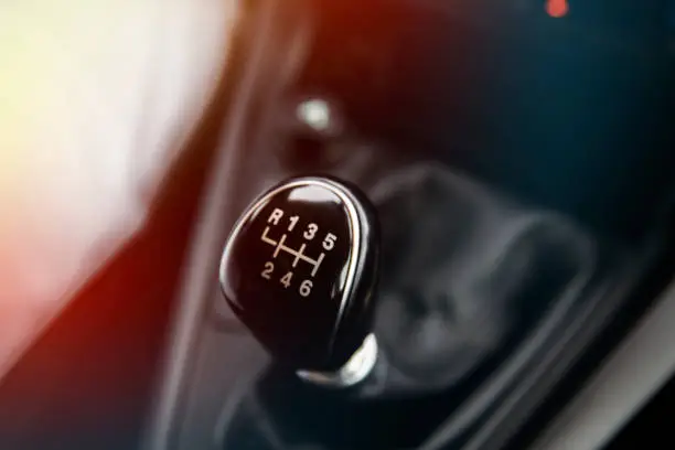 Photo of Close up of top of gear stick in car