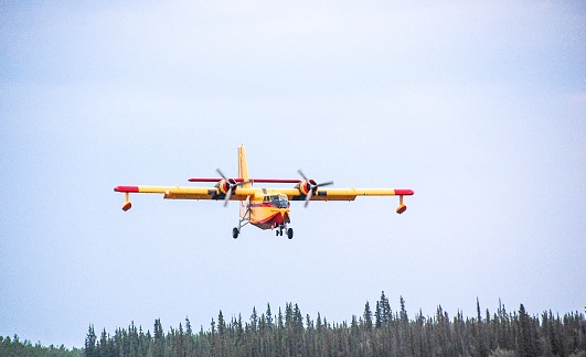 Firefighting in Alaska is being assisted by a Canadian force. This Canadian CL-415 is a very affective too in fighting fires. These planes have the ability to scoop up water and drop a water bomb to help fight fires. This bright yellow plane makes an impressive entrance to Alaska. Landing in Interior Alaska to refuel, it was a great opportunity to view this plane..