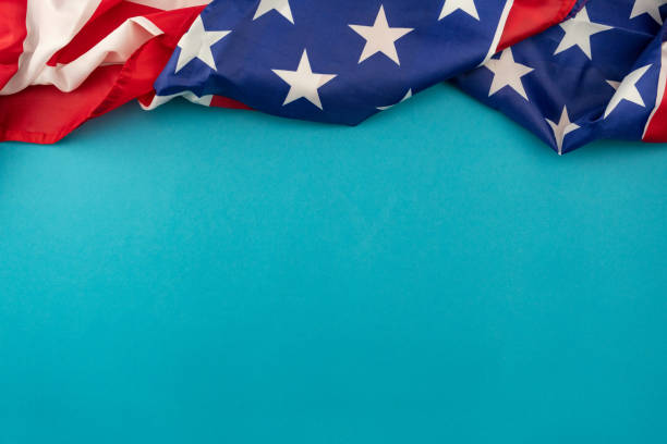 istock American Flag on blue background with copy space for your text. 1219272949