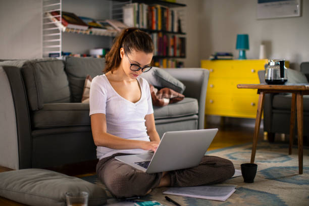 istock Young woman working from home 1219273735