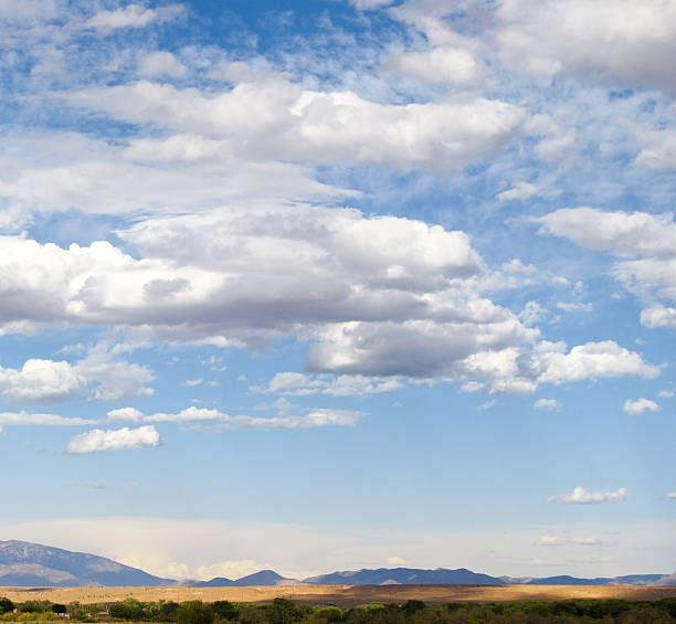 istock Blue Sky and Fluffy Clouds over Southwest Landscape 121927643