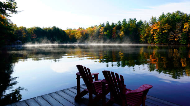 istock Sunrise above forest lake 1219277734