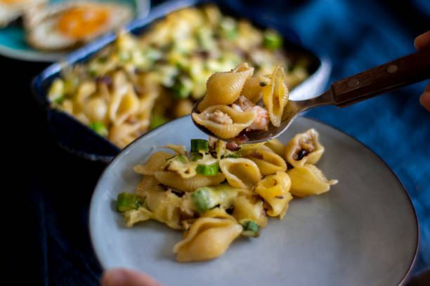 istock homemade breakfast:cheese toasted conchiglie, with shrimp and asparagus 1219282936