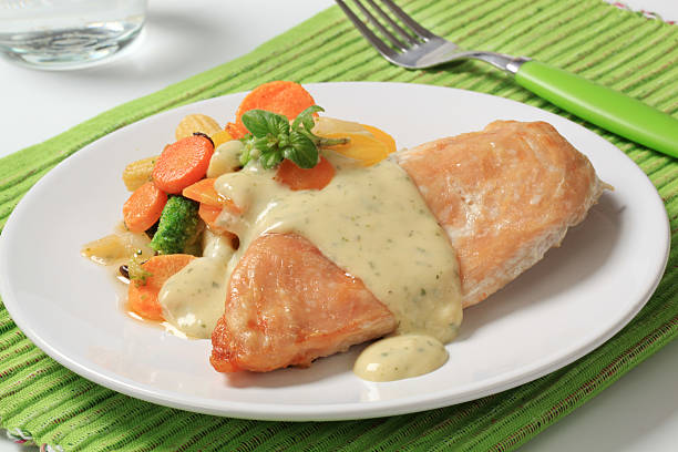istock Chicken breast and mixed vegetables poured with sauce 121928302