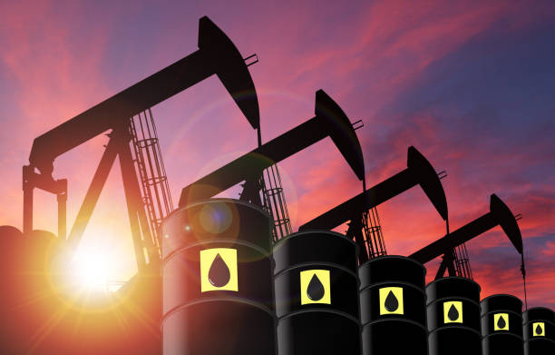 tramonto su pumpjack silhouette e barile di petrolio con spazio di copia - oil pump oil industry alberta equipment foto e immagini stock