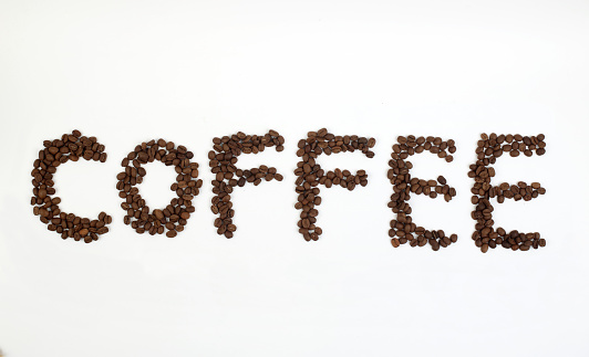 The word 'coffee' made with coffee beans