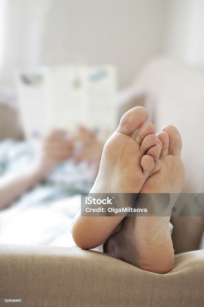 man relaxing on sofa  Adult Stock Photo