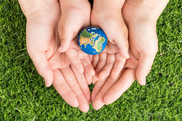 istock A model of the earth in hand 1219290006