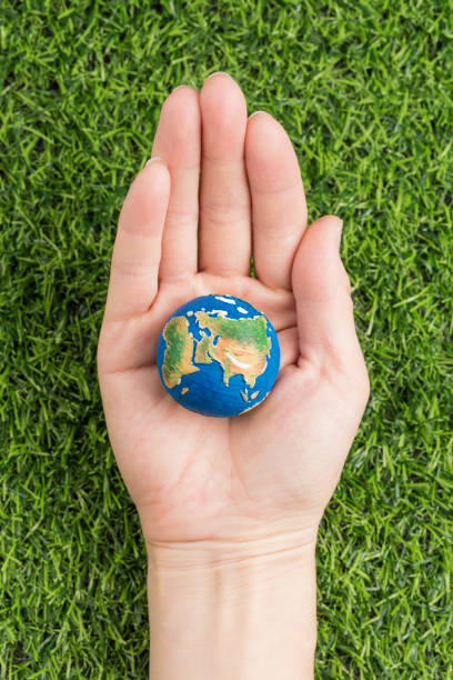 istock A model of the earth in hand 1219290008
