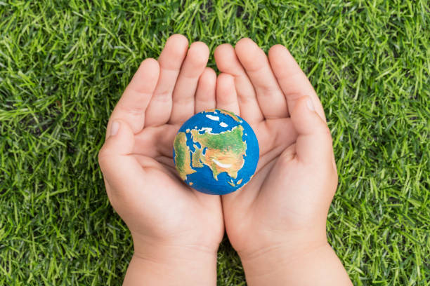 istock A model of the earth in hand 1219290011