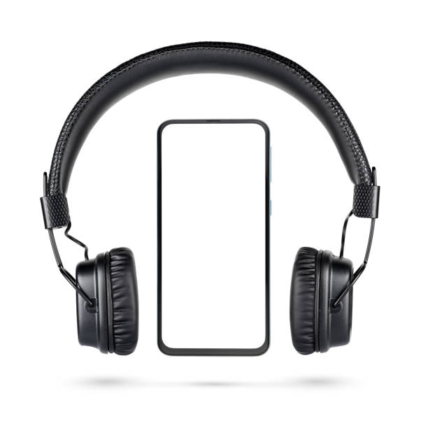 istock Wireless black headphones and bezel-less cellphone isolated 1219290053