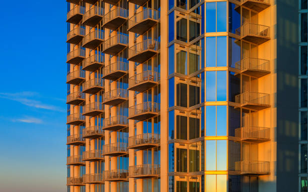 istock Modern new construction skyscraper downtown Austin, Texas at golden hour of sunset, sky reflecting in the windowsâ glass 1219292057