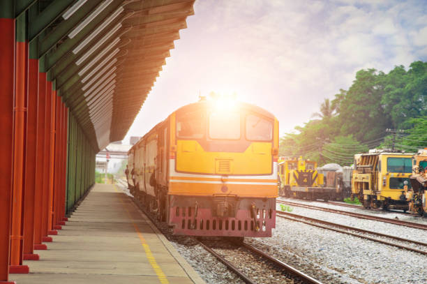 istock Thai Yellow train is running to the station. 1219292821