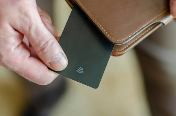 istock Hand takes out a bank card from the wallet. 1219294825