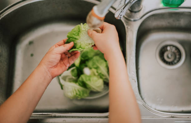 istock Sanitize food using water in home kitchen directly above angle 1219299099