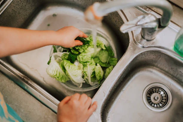 istock Sanitize food using water in home kitchen directly above angle 1219299103