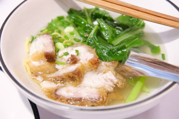 istock Egg Noodle and Soup with Crispy Pork 1219299397