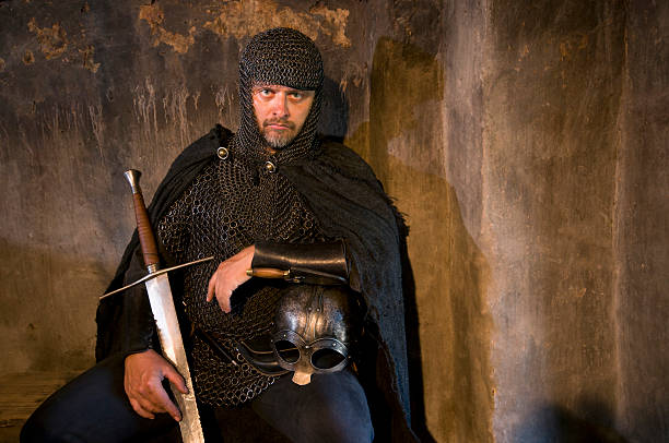 istock Seated knight with sword and helmet 121930137