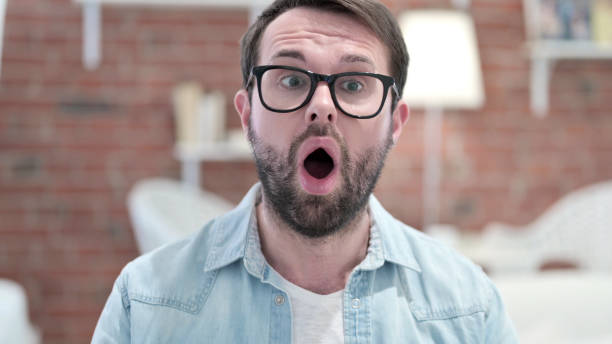 istock Beard Young Man Wondering with Open Mouth 1219301461
