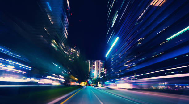 istock Driving on the road urban lights 1219301706