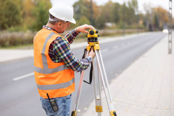 istock Construction workers setting equipment in the middle of the road structure 1219301788