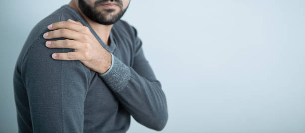 istock shoulder pain; a man has health problems 1219301877