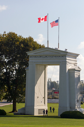 Blaine, WA, USA - Oct 14, 2019: The Peace Arch, a monument situated near the westernmost point of the Canada–United States border. The U.S. border checkpoints are seen in the background.