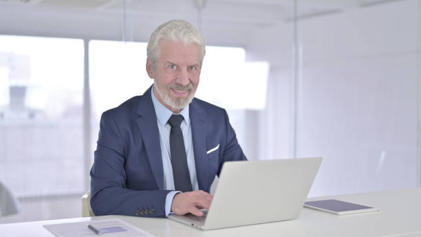 istock Ambitious Businessman Looking at the Camera and Smiling 1219305102