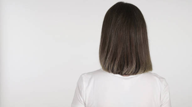 istock Young Woman Praying to God, White Background 1219306269