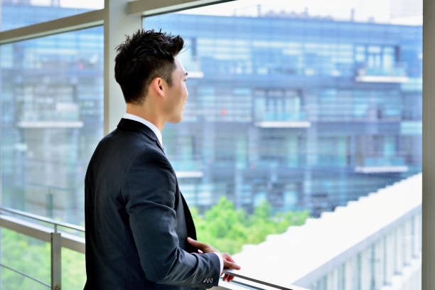 istock One Asian Business Man Thinking at Window 1219306280