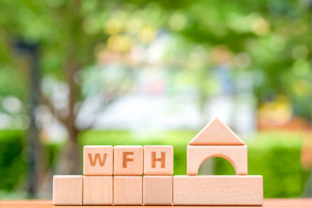 istock Wooden blocks with the word WFH. Concept work from home. 1219307556