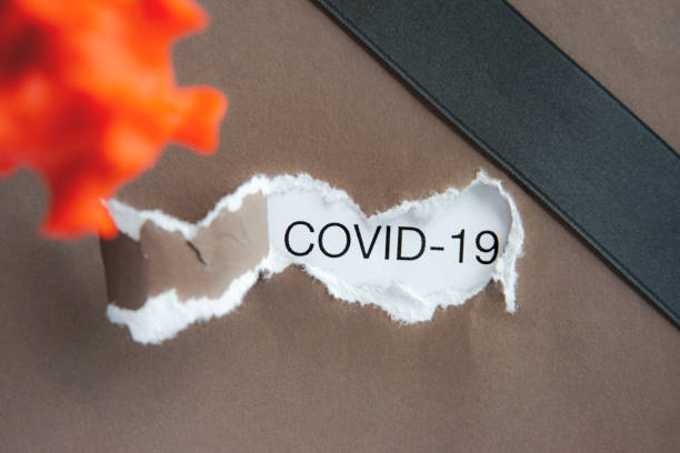 istock Note Covid-19, black ribbon in the corner. RIP, mourning concept. 1219308519