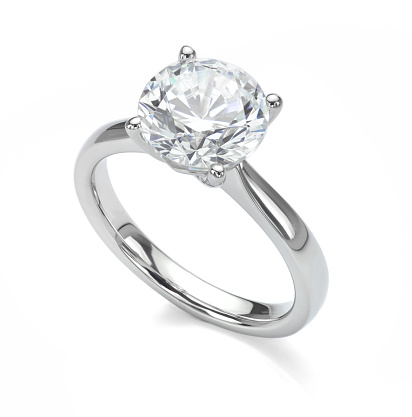 Big diamond solitaire engagement ring in platinum or white gold isolated on a white background.