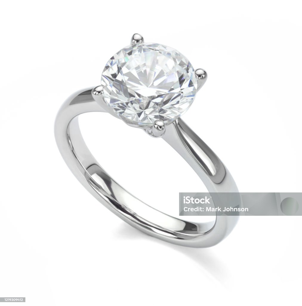 Diamond Ring Isolated on White Engagement Solitaire Style Ring Big diamond solitaire engagement ring in platinum or white gold isolated on a white background. Ring - Jewelry Stock Photo