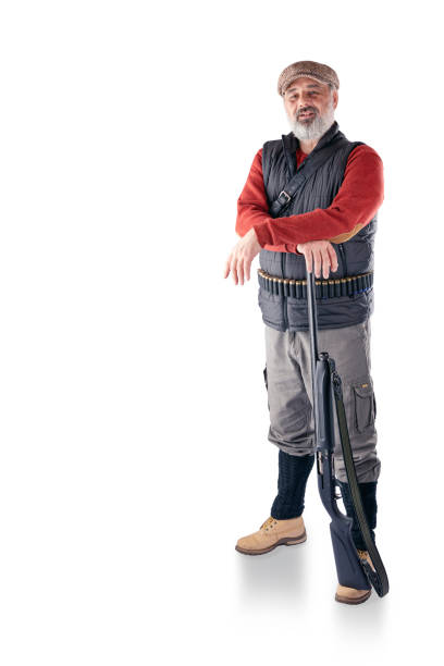 istock A man with a gray beard with a bag and a gun. 1219310295