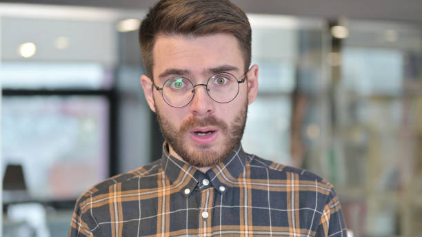istock Portrait of Shocked Young Designer in Awe at Work 1219310696