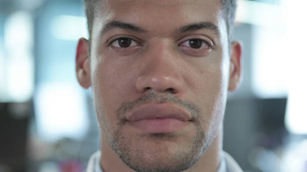 istock Close Up of Serious African Man looking at Camera 1219310927