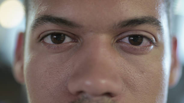 istock Close Up of African Man Blinking Eyes in Camera 1219311675
