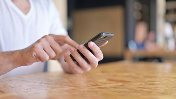istock Close Up of Man Using Smartphone 1219311889