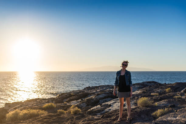 istock A young women posing by the coast 1219312066