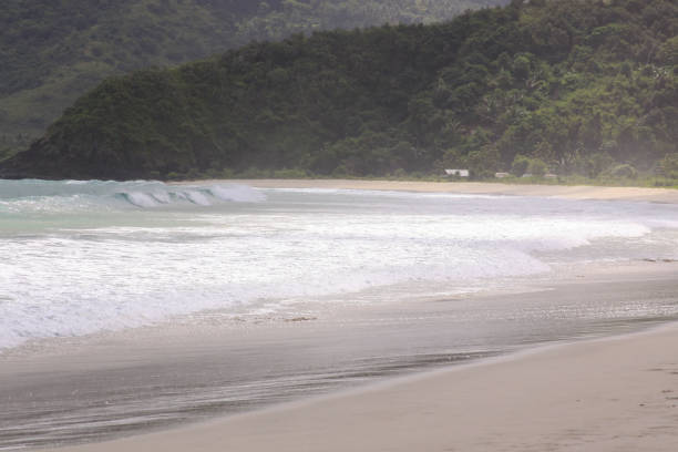 istock Breaking surf waves at Mawun beach Lombok 1219314563
